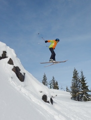 Kyle Banerjee skiing off a cornice
